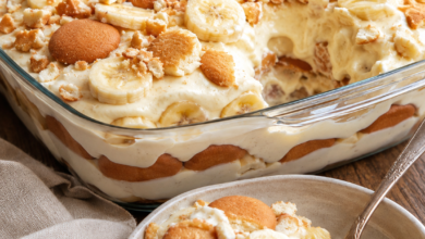 Homemade banana pudding layered with fresh bananas and vanilla wafers in a glass baking dish.