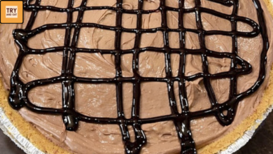 Creamy 4 ingredient chocolate pudding pie with chocolate syrup drizzle in graham cracker crust