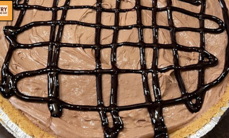 Creamy 4 ingredient chocolate pudding pie with chocolate syrup drizzle in graham cracker crust