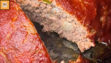 Juicy Creole meatloaf with ketchup glaze and bell peppers sliced in baking dish