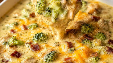 Creamy chicken bacon broccoli cheddar soup with crispy bacon, tender chicken, broccoli, melted cheddar cheese, and toasted bread.