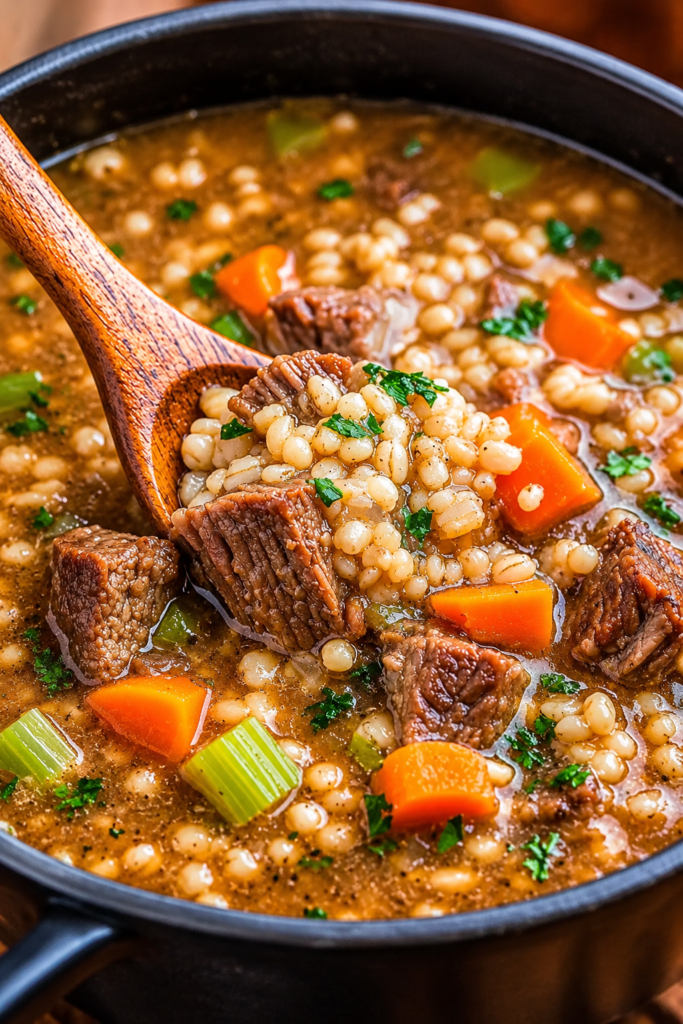 Homemade beef barley soup with tender beef, pearl barley, carrots, celery, and rich savory broth.