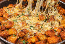 Cheesy garlic parmesan potatoes with melted mozzarella and crispy roasted cubes