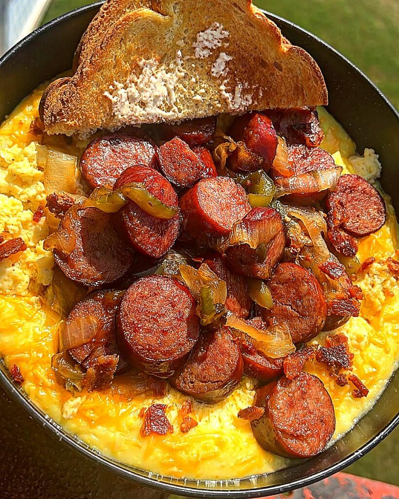 loaded sausage egg breakfast bowl with bacon and melted cheese