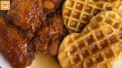 Crispy fried chicken wings served with heart-shaped waffles and syrup