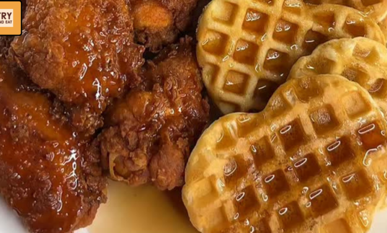 Crispy fried chicken wings served with heart-shaped waffles and syrup