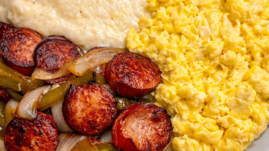 Southern breakfast skillet with cheesy grits, fluffy scrambled eggs, and crispy sausage slices