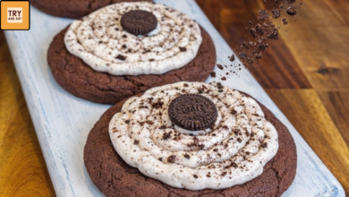 Healthy Crumbl style Oreo protein cookies with creamy frosting and Oreo crumble topping.