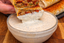 crispy high protein pizza burrito dipped in creamy sauce with cheesy filling