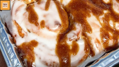 Gooey cinnamon rolls topped with white glaze and cinnamon caramel sauce.