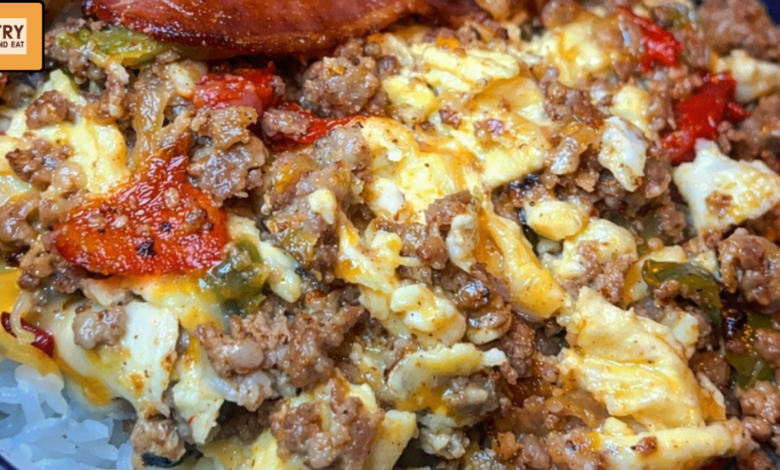 loaded breakfast bowl with rice scrambled eggs bacon and ground beef