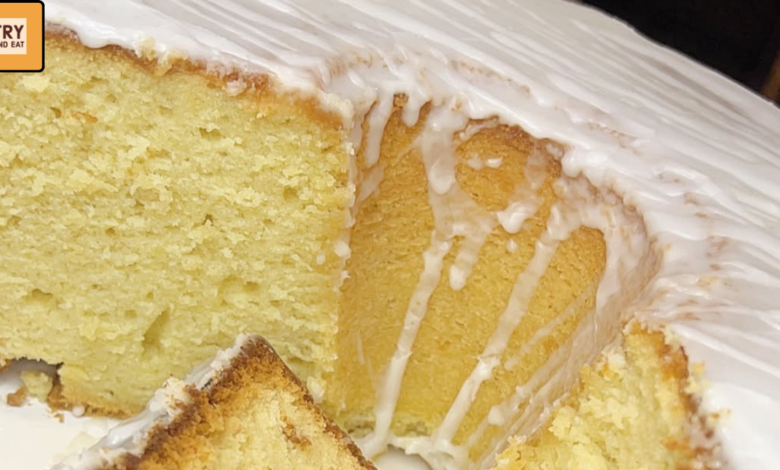 Dense lemon Bundt pound cake slice with cream cheese glaze