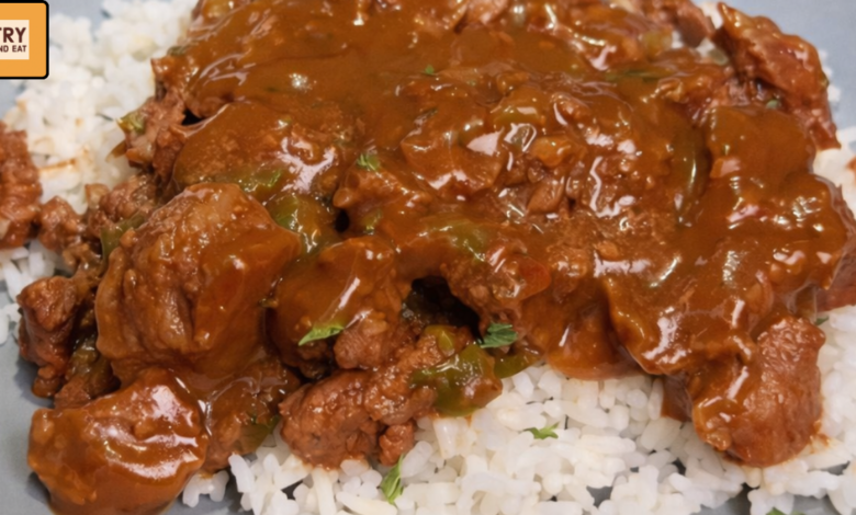 Tender no peek beef tips served over rice with rich onion gravy baked in the oven