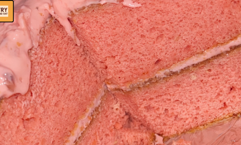 Homemade strawberry cake with creamy cheesecake frosting and dense crumb