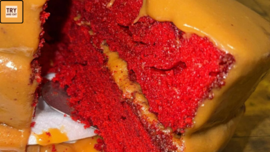Slice of salted caramel red velvet cake with caramel drip