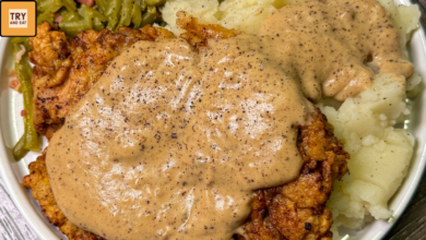 Southern country fried steak with homemade white gravy served in a skillet