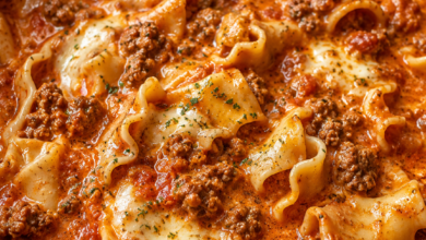 Creamy crockpot lasagna soup with ground beef, mozzarella cheese, tomato broth, and lasagna noodles in a slow cooker.