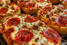 Pepperoni pizza toast made on Texas toast with mozzarella cheese, Italian sausage, and crispy pepperoni.