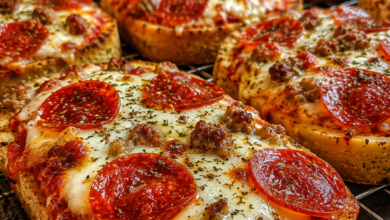Pepperoni pizza toast made on Texas toast with mozzarella cheese, Italian sausage, and crispy pepperoni.