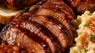Juicy smoked chuck roast sliced and glazed with barbecue sauce served with baked beans and potato salad