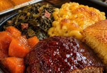 Juicy southern meatloaf with brown sugar glaze served with mac and cheese and collard greens