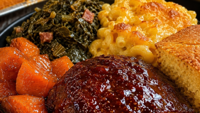 Juicy southern meatloaf with brown sugar glaze served with mac and cheese and collard greens